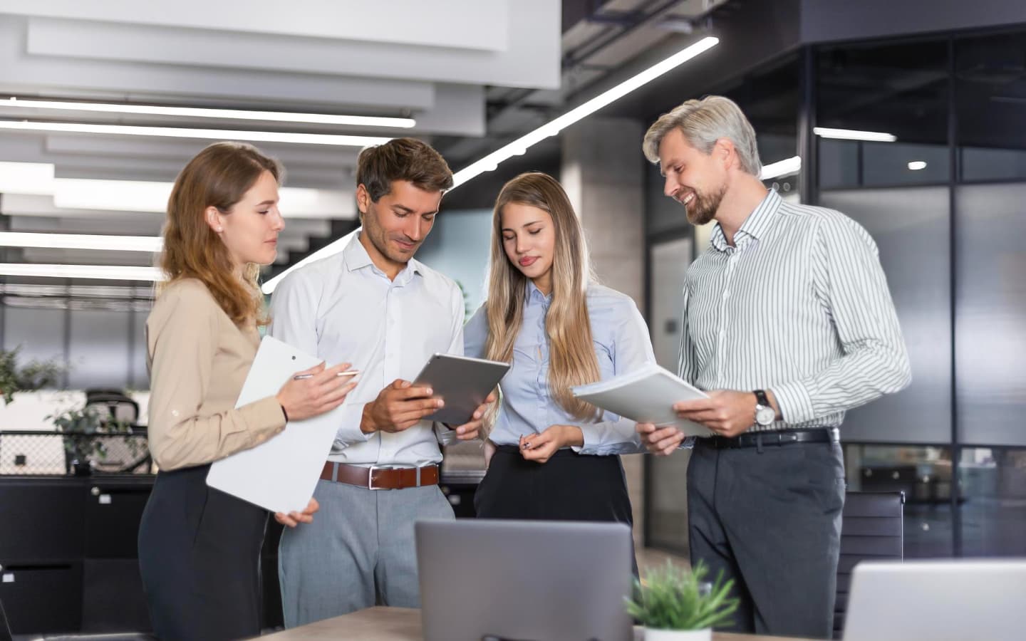 Business person shows ISO 27001 software
